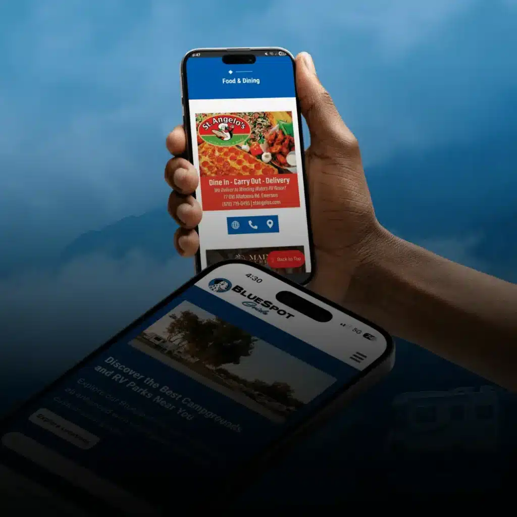 Hand holding a smartphone showing a restaurant listing in a campground local area guide with a second phone displaying BlueSpot.
