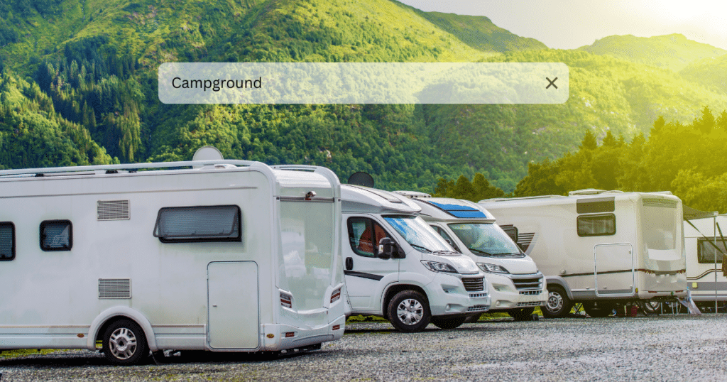 RVs at a campground with a search bar graphic, representing how campground blog content helps drive more website traffic.