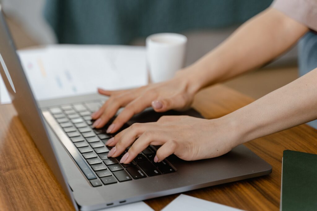 Person booking a campground stay online using a laptop