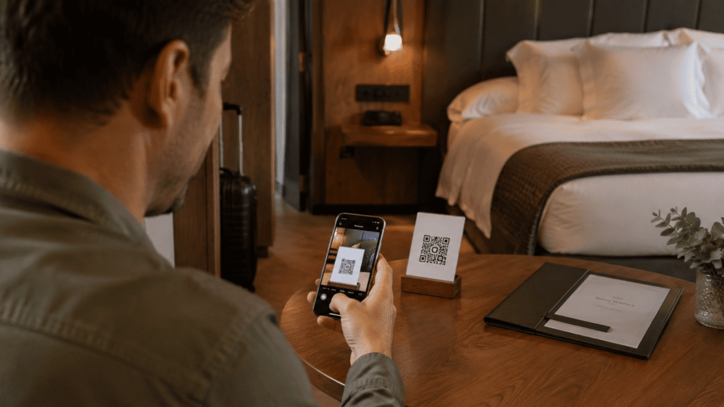 Hotel guest scanning a QR code with a smartphone